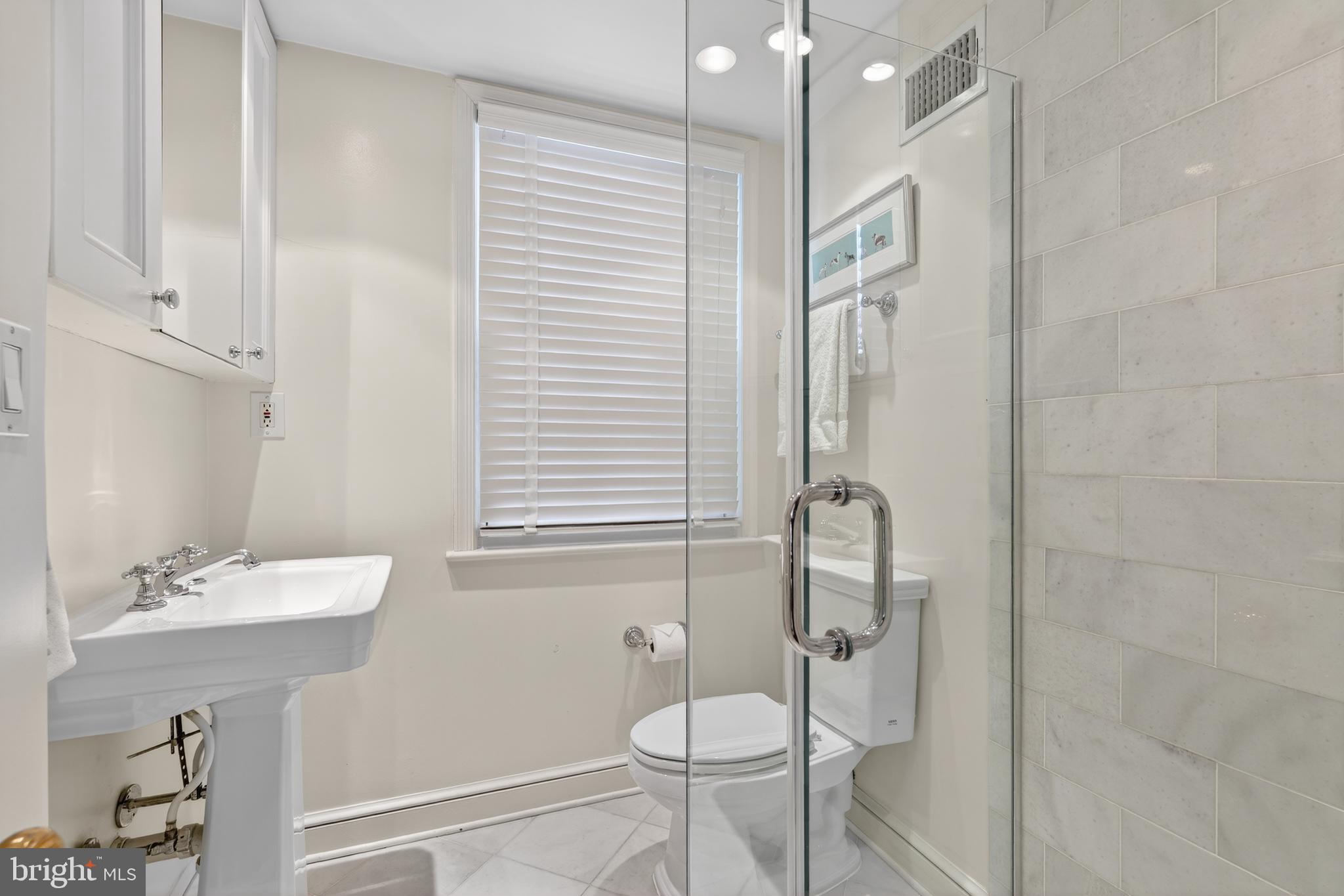 2238 47th Street Northwest Washington, DC 20007 - Photo 32 of 42 a bathroom with a sink toilet and shower