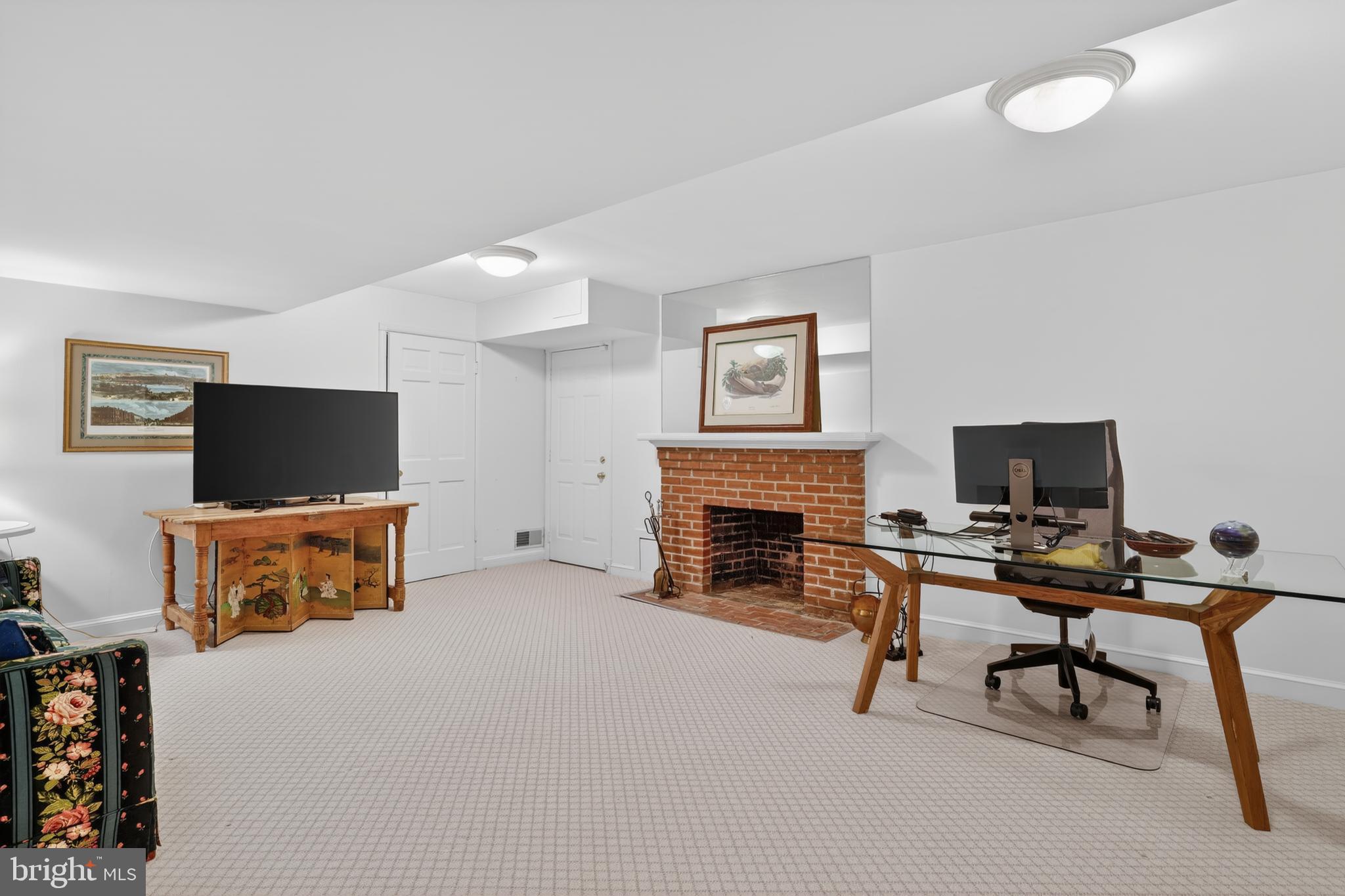 2238 47th Street Northwest Washington, DC 20007 - Photo 34 of 42 a living room with furniture and a flat screen tv