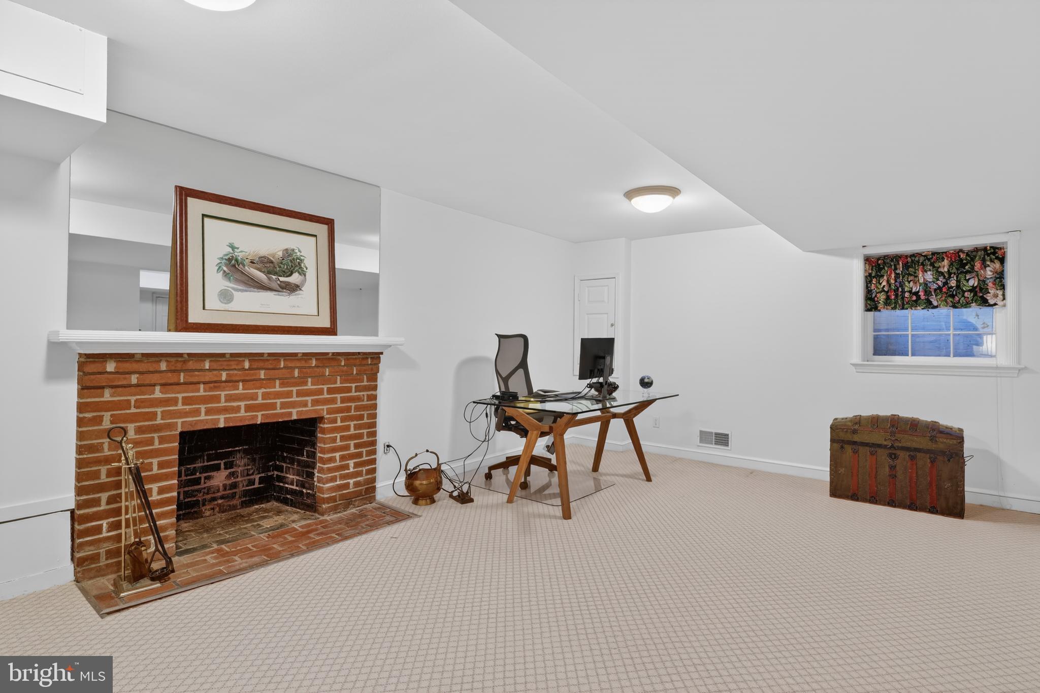 2238 47th Street Northwest Washington, DC 20007 - Photo 35 of 42 a living room with furniture and a fireplace
