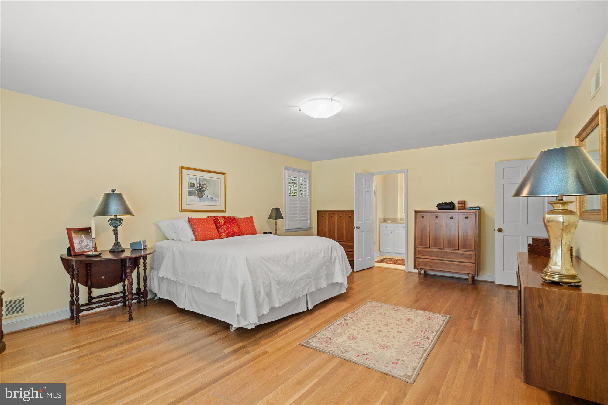 2238 47th Street Northwest Washington, DC 20007 - Photo 37 of 67 a bedroom with a bed and wooden floor