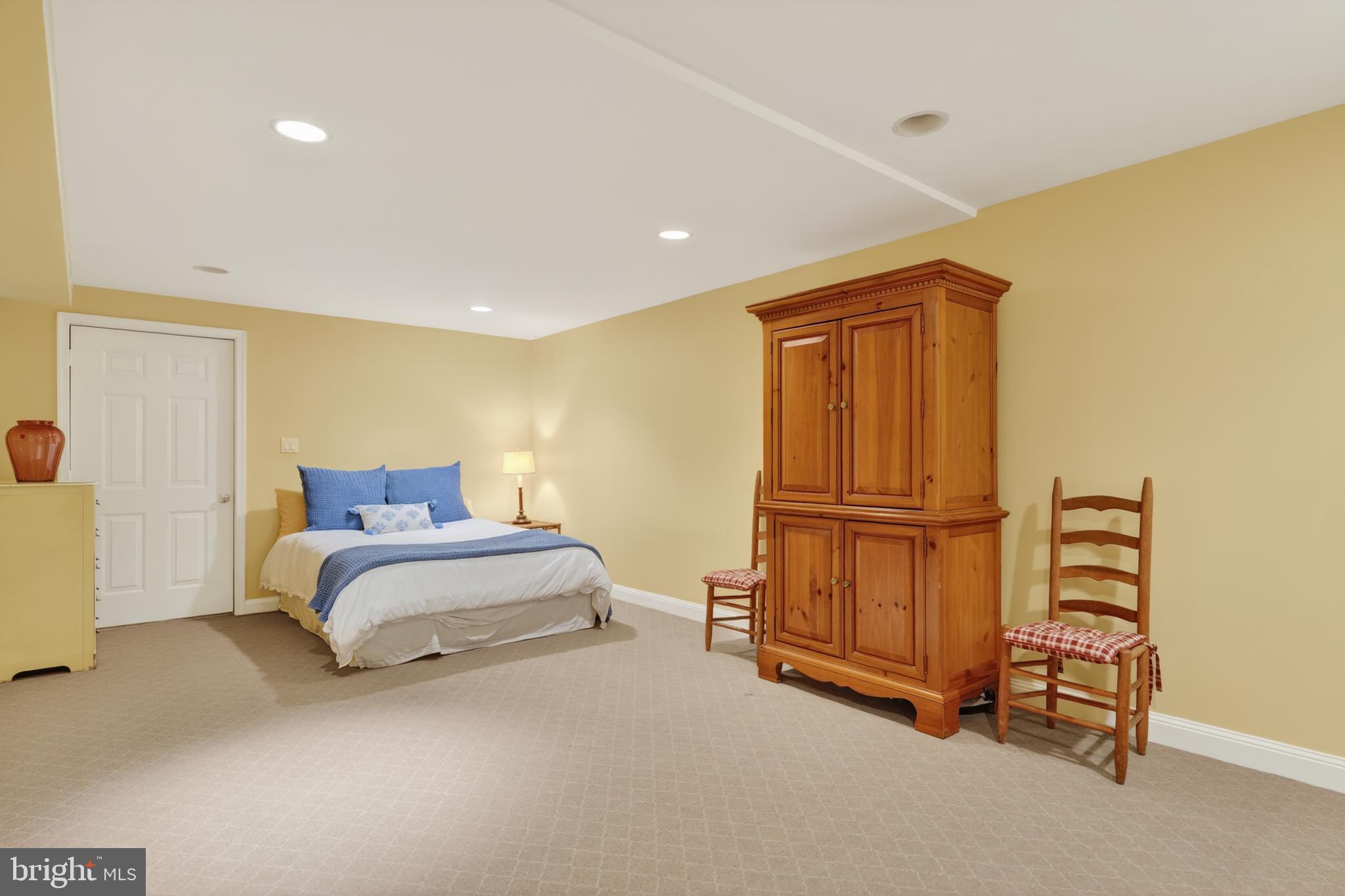 2238 47th Street Northwest Washington, DC 20007 - Photo 38 of 42 a spacious bedroom with a bed and dresser
