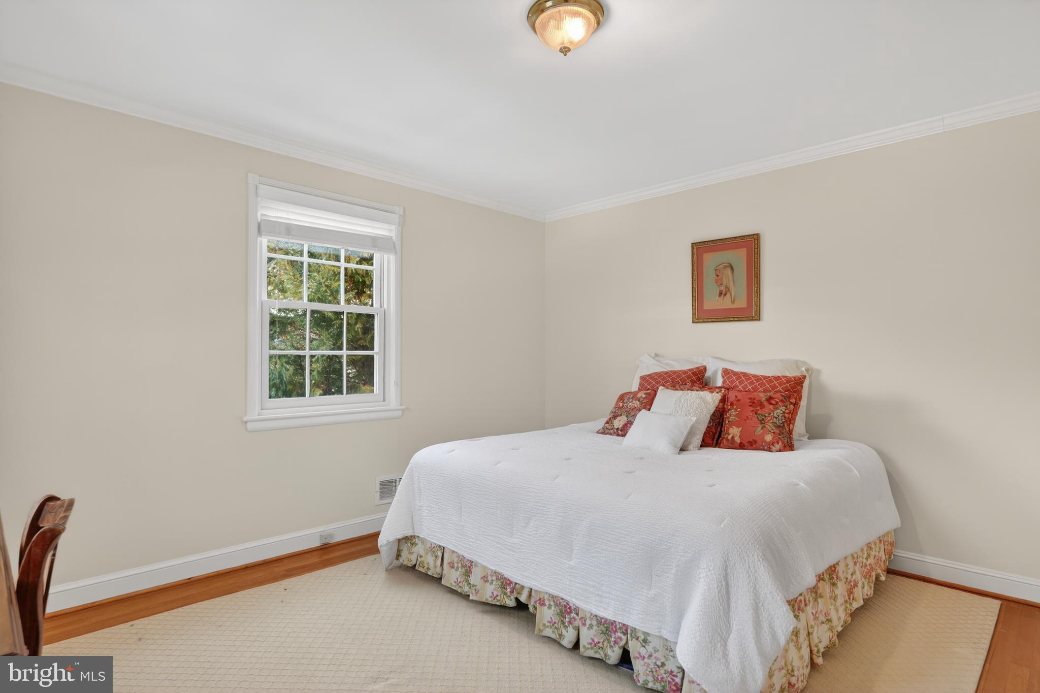 2238 47th Street Northwest Washington, DC 20007 - Photo 44 of 67 a bedroom with a bed and a window