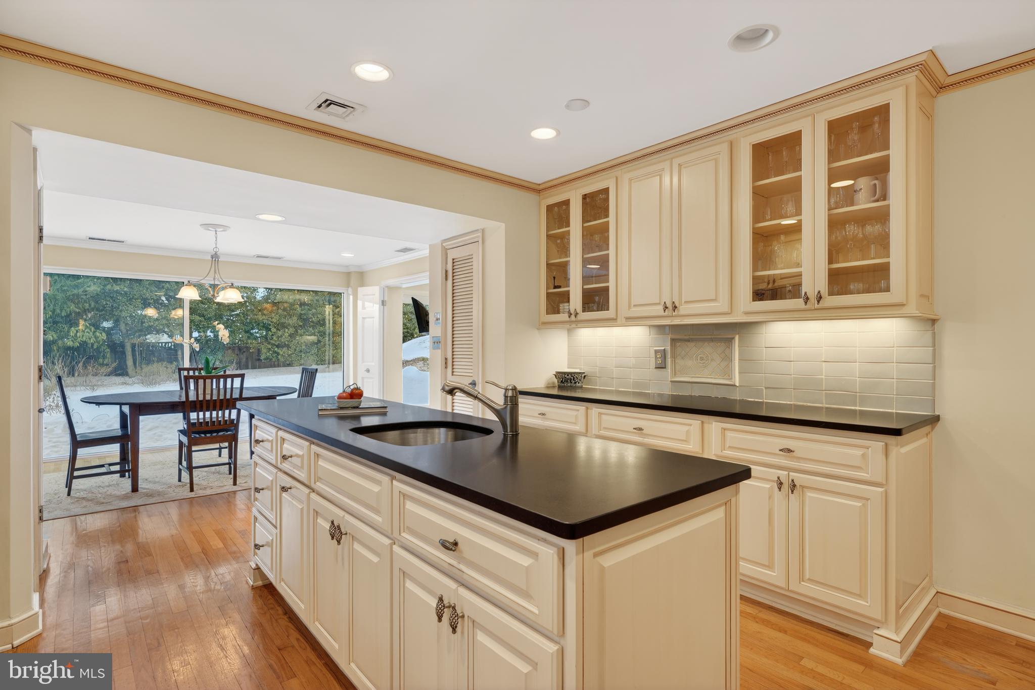 2238 47th Street Northwest Washington, DC 20007 - Photo 8 of 42 a kitchen with granite countertop a sink and cabinets