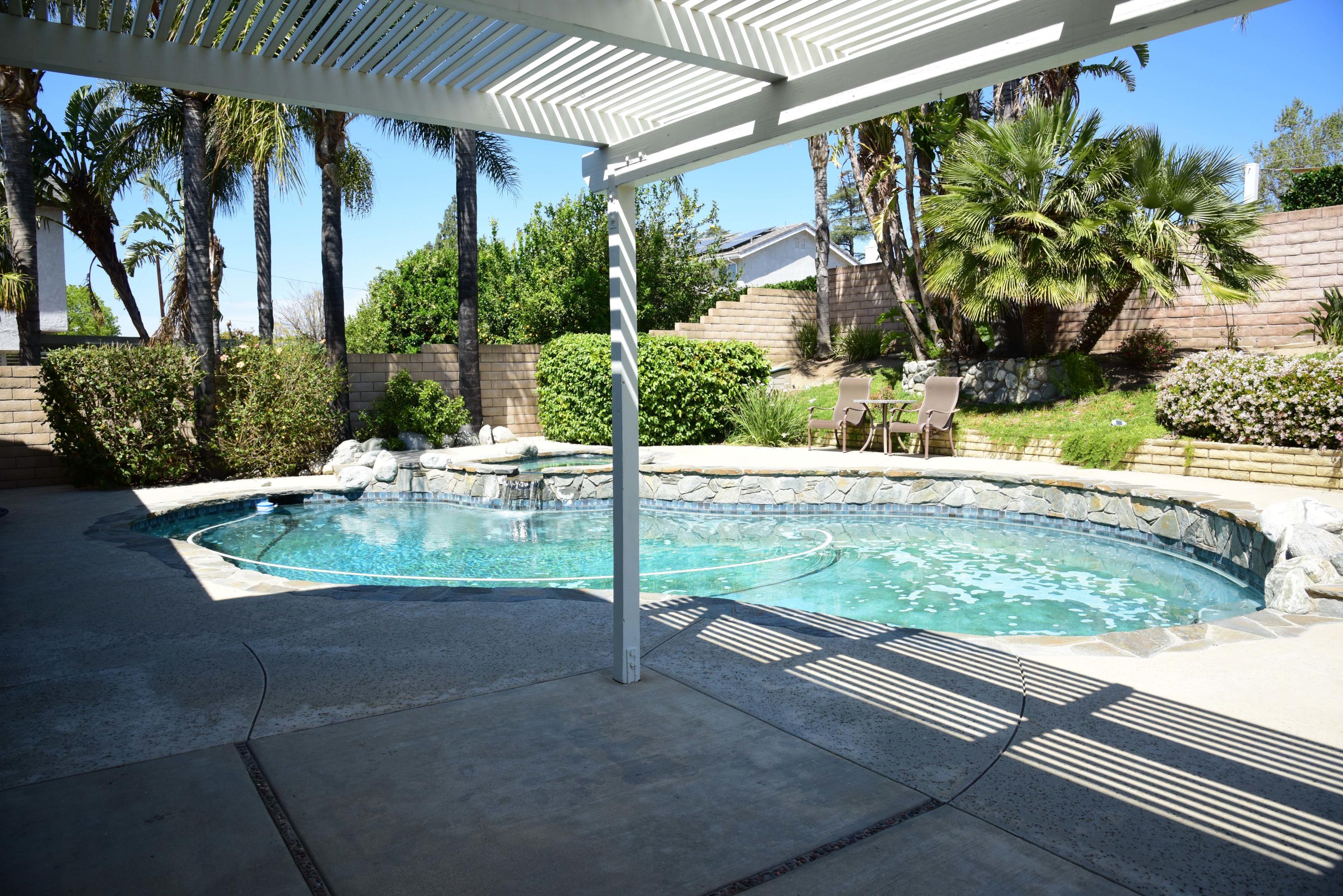 4283 Springfield Street Simi Valley, CA 93063 - Photo 22 of 25 a view of small yard in front of a house with potted plants