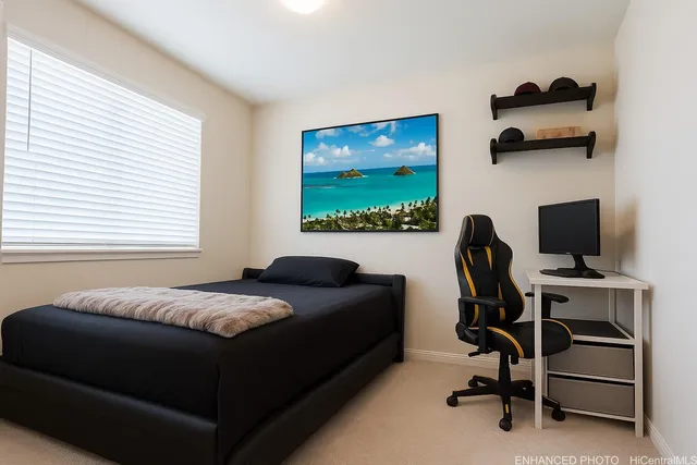 a bedroom with a workspace