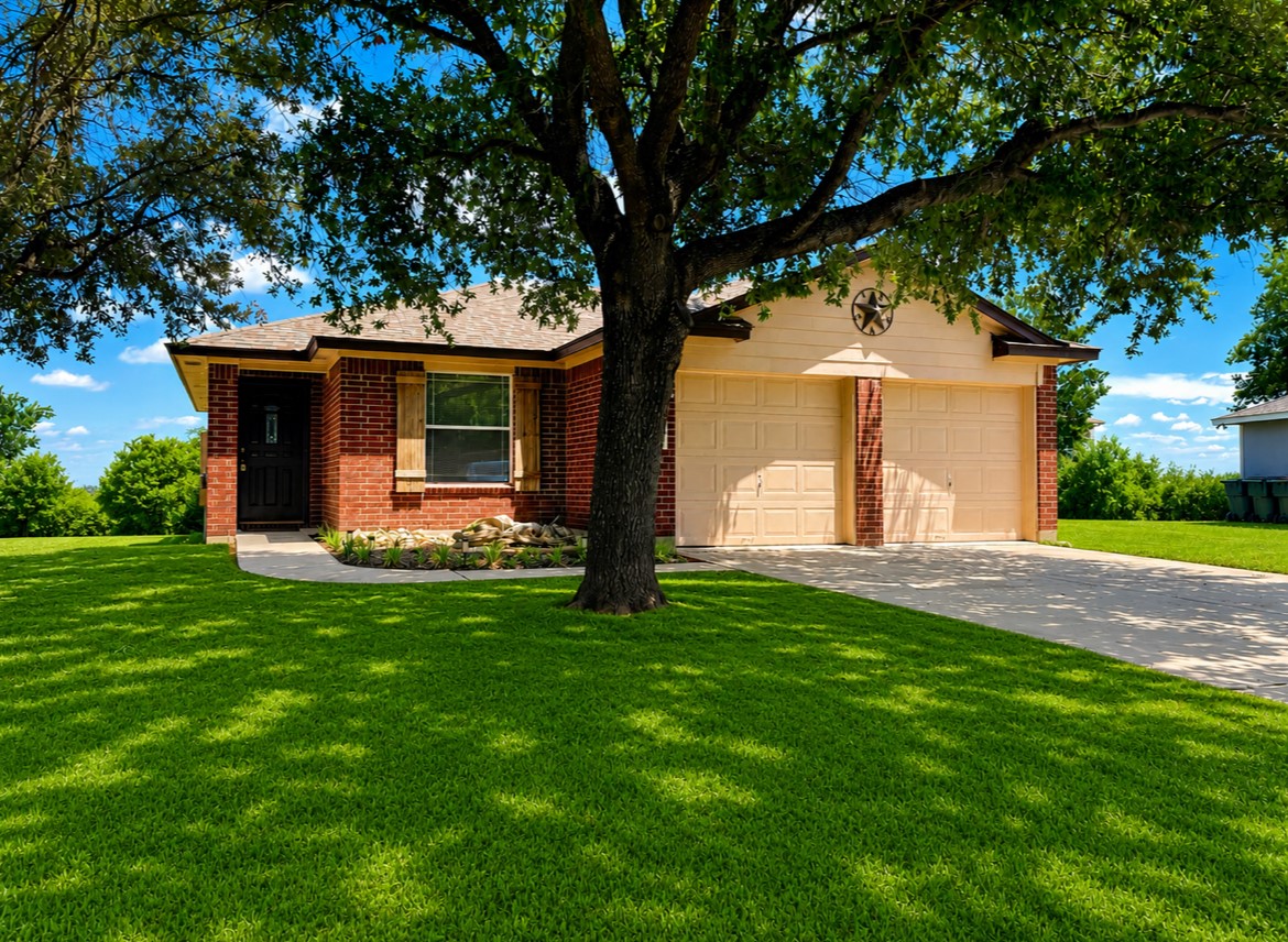 359 Spring Branch Loop Kyle, TX 78640 - Photo 2 of 17 a front view of house with yard and green space