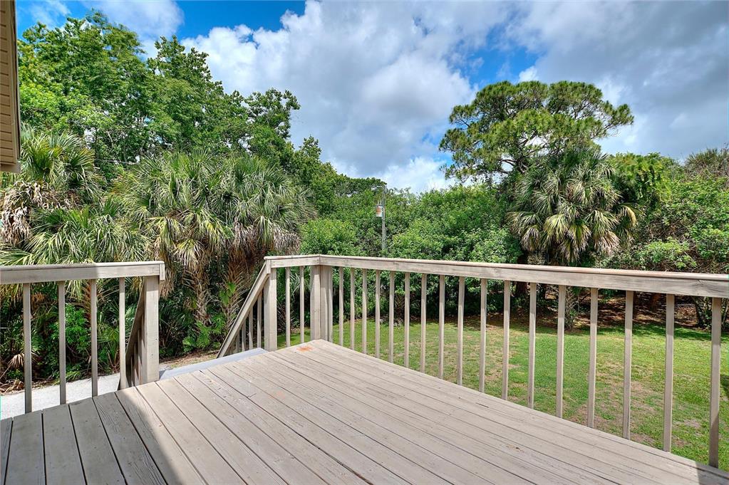 3641 Turtle Mound Road Melbourne, FL 32934 - Photo 49 of 77 a view of balcony with wooden floor