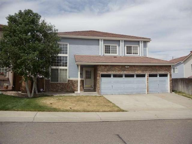 4085 Genoa Street Denver, CO 80249 - Photo 1 of 1 a front view of house with yard
