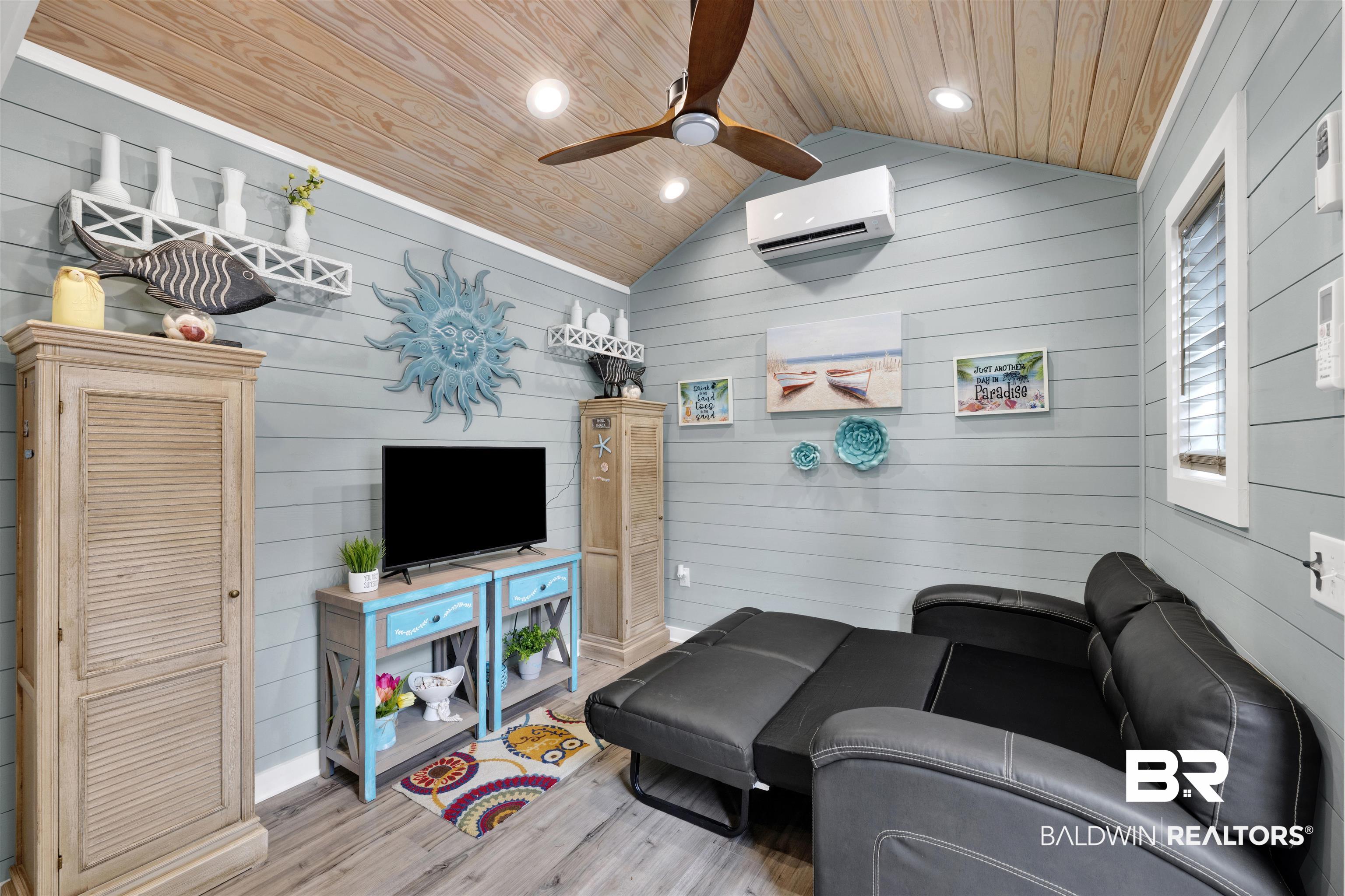 4650 Griffith Marina Road, Unit LOT 24 Orange Beach, AL 36561 - Photo 7 of 34 Living area with wooden walls, a ceiling fan, wood finished floors, wood ceiling, and recessed lighting