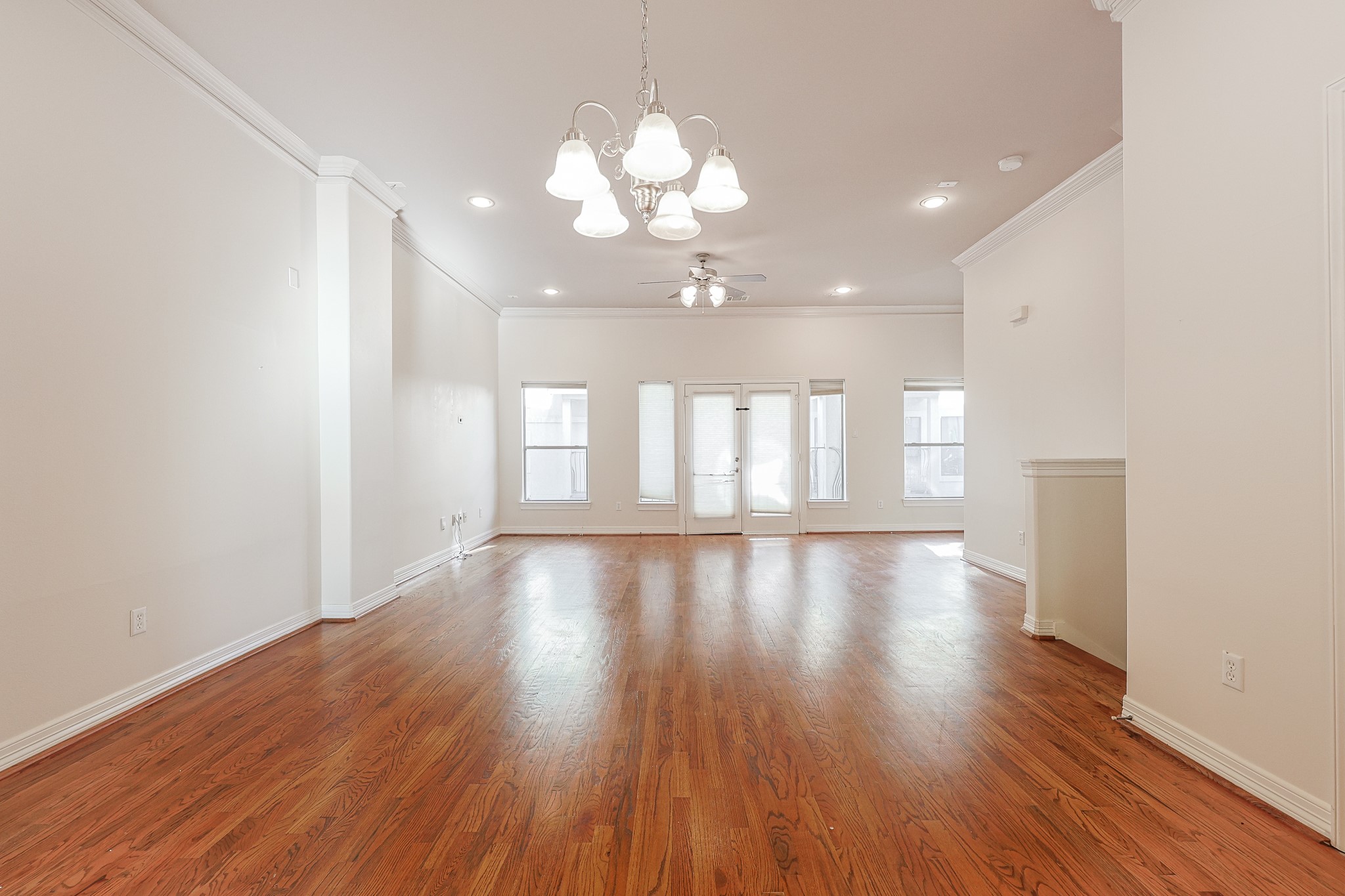 2540 Prospect Street, Unit C Houston, TX 77004 - Photo 5 of 31 a view of an empty room with wooden floor and a window