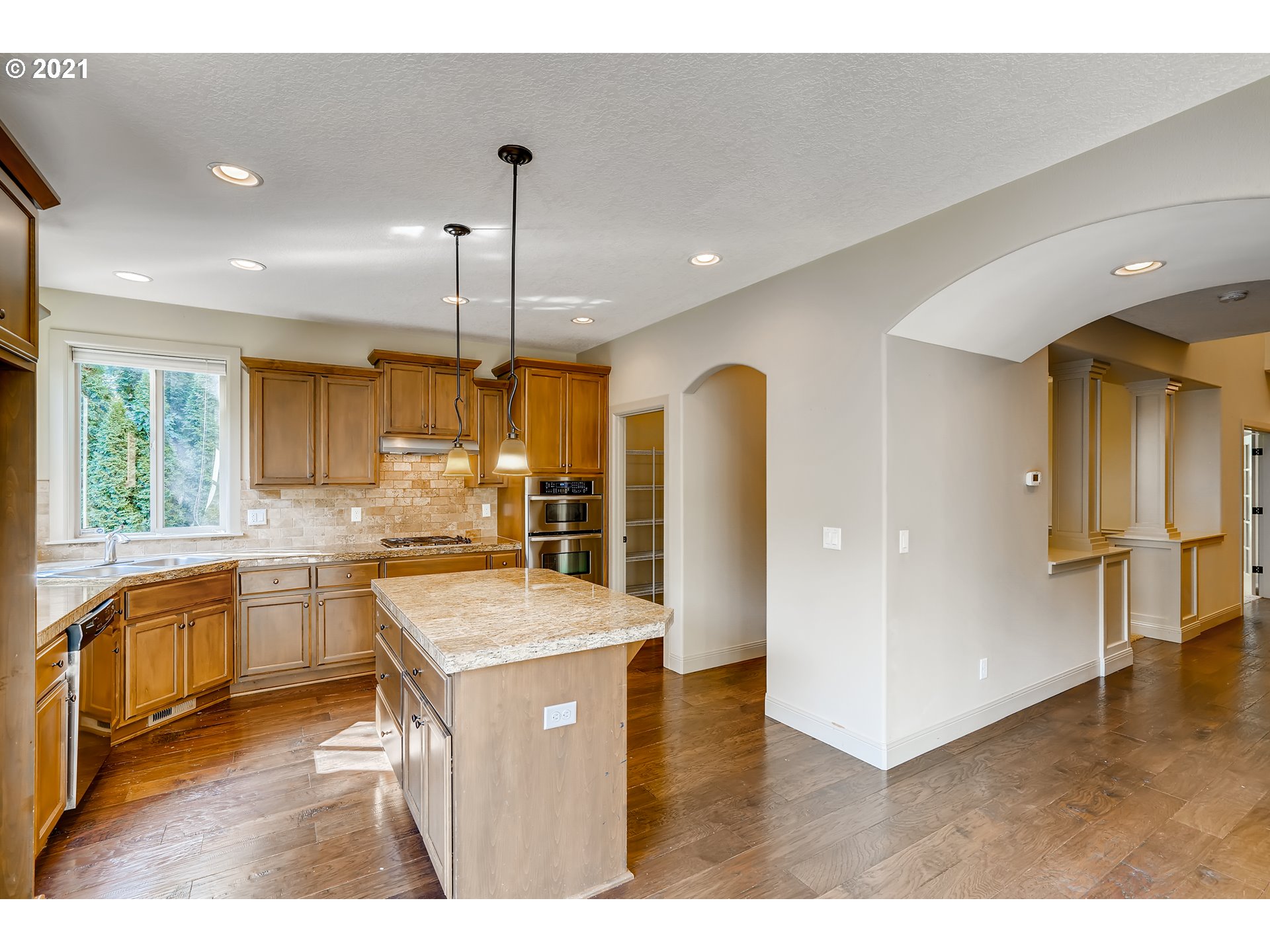 18378 Southwest Jeremy Street Beaverton, OR 97007 - Photo 11 of 31 a kitchen with stainless steel appliances granite countertop sink refrigerator and stove