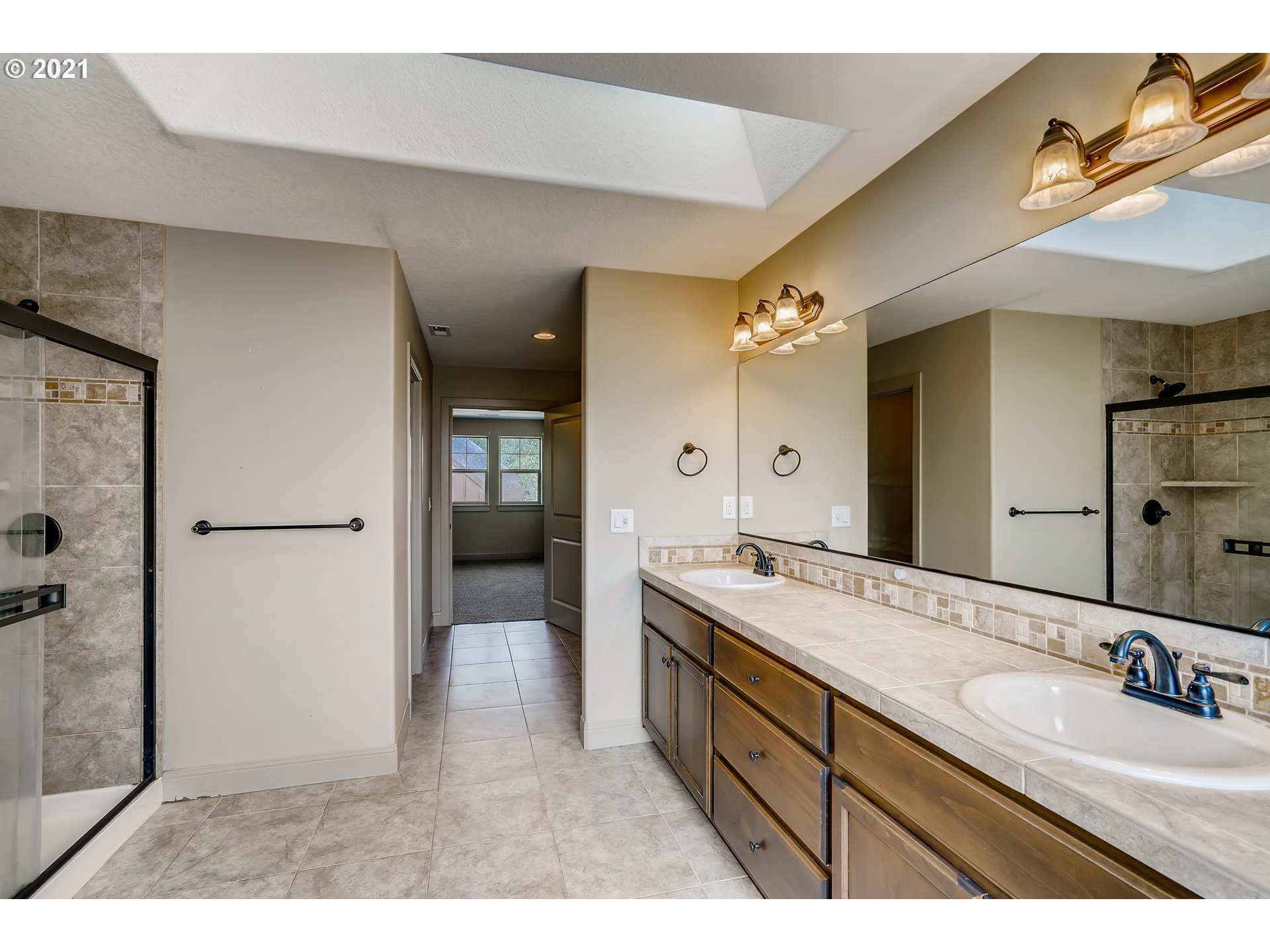 18378 Southwest Jeremy Street Beaverton, OR 97007 - Photo 21 of 31 a bathroom with a granite countertop sink mirror and a