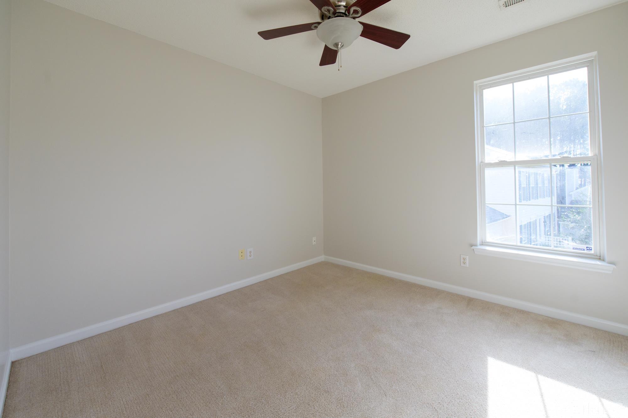 6809 Edwell Court Raleigh, NC 27617 - Photo 20 of 26 an empty room with a window