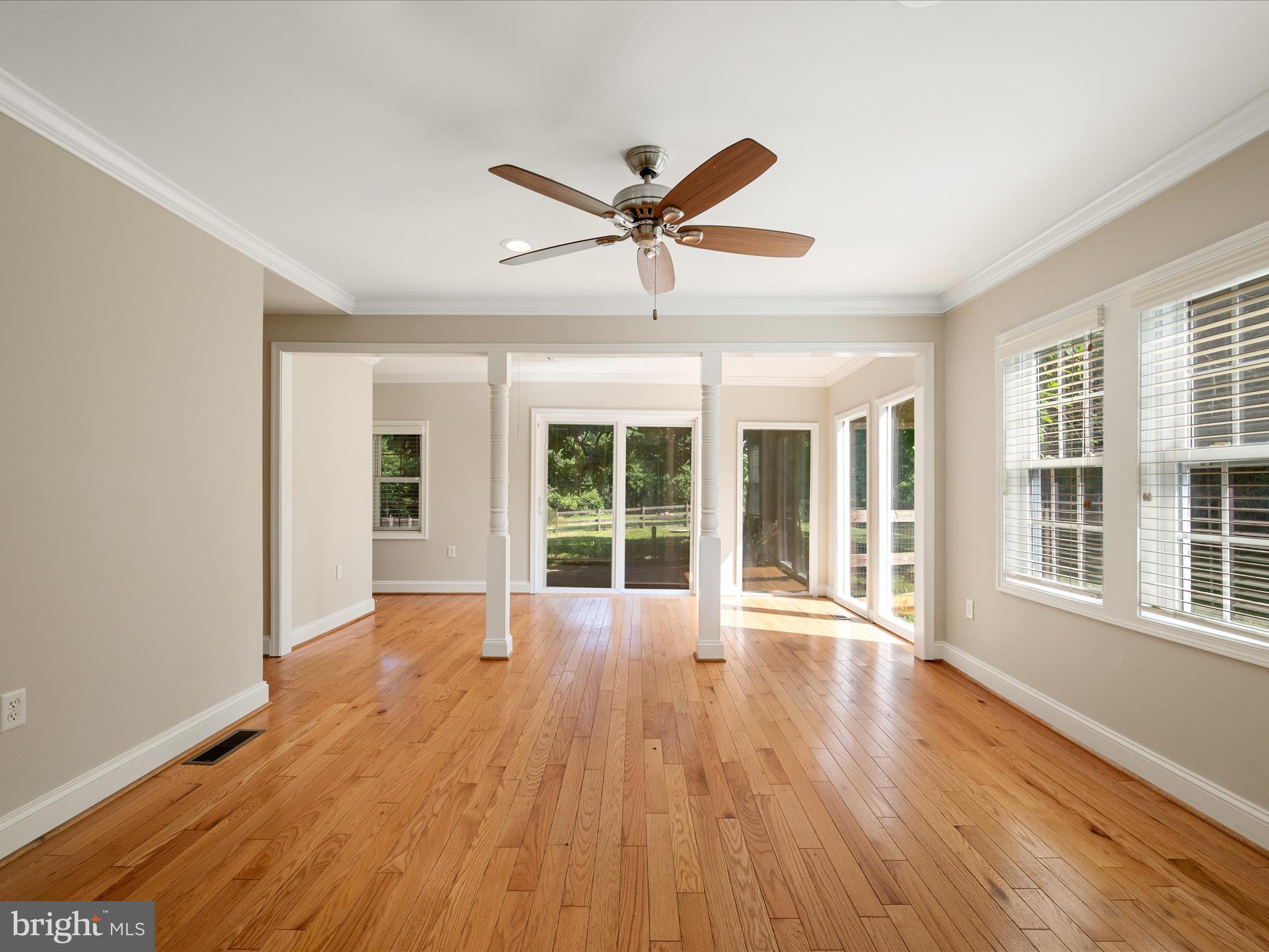 87 Old Waterloo Road Boyce, VA 22620 - Photo 15 of 76 a view of a livingroom with wooden floor and a ceiling fan