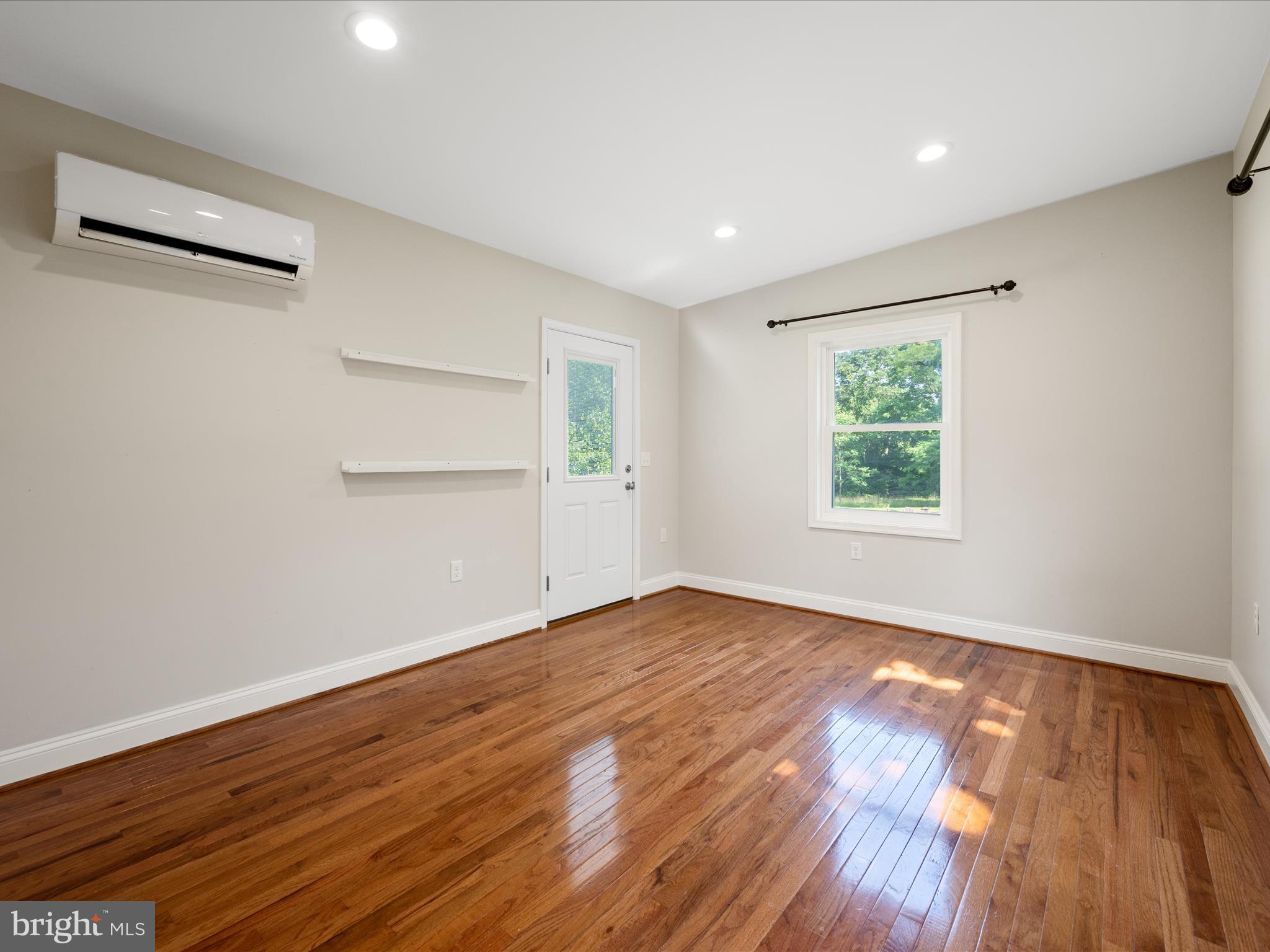 87 Old Waterloo Road Boyce, VA 22620 - Photo 24 of 76 an empty room with wooden floor and windows