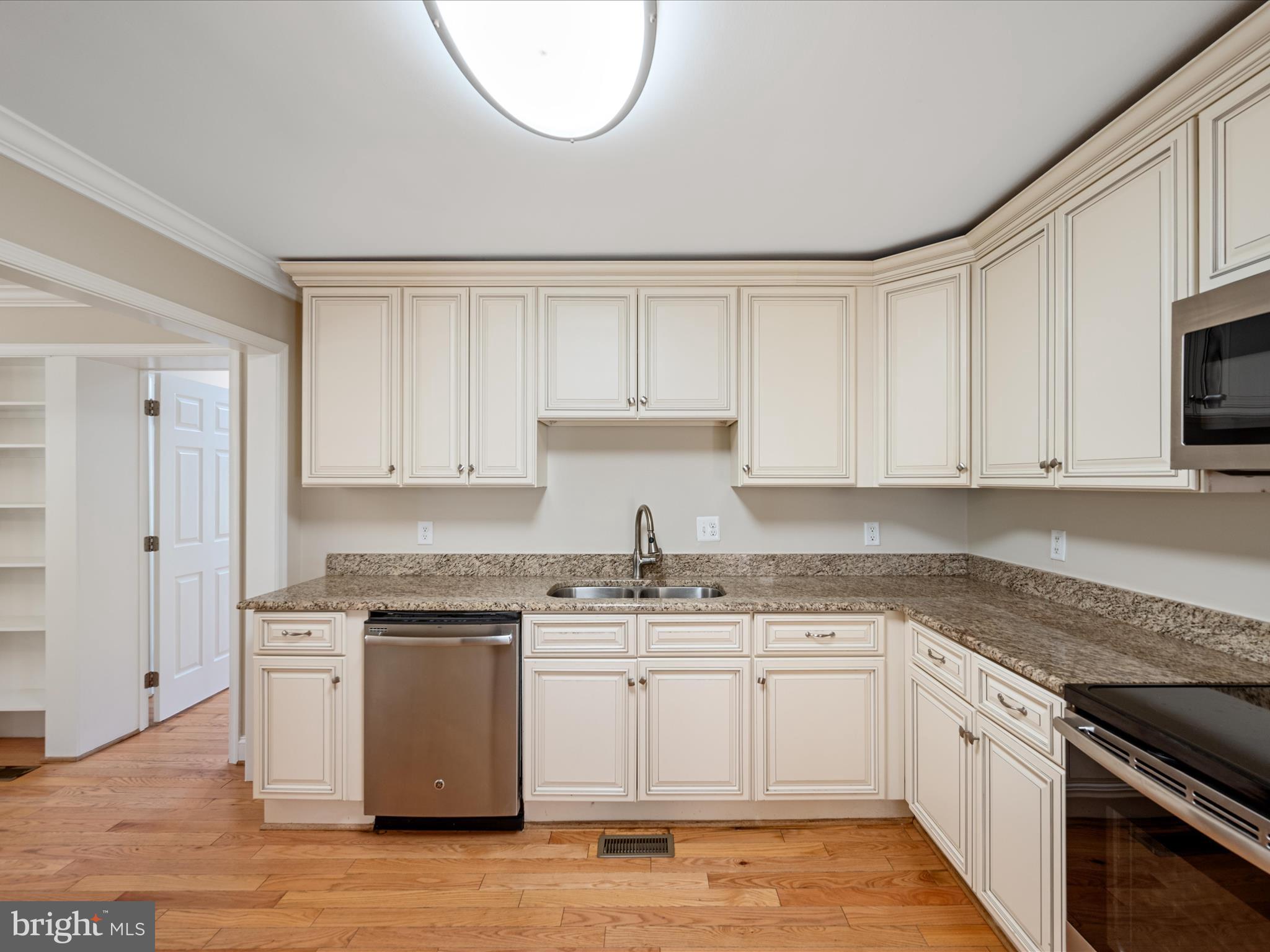 87 Old Waterloo Road Boyce, VA 22620 - Photo 27 of 76 a kitchen with stainless steel appliances granite countertop a sink a stove a microwave and cabinets