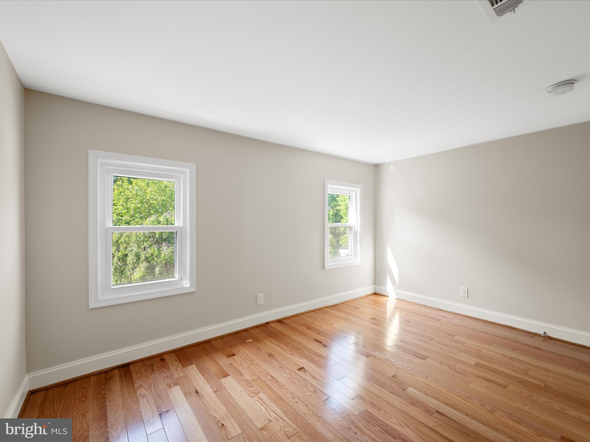 87 Old Waterloo Road Boyce, VA 22620 - Photo 39 of 76 a view of an empty room with wooden floor and a window