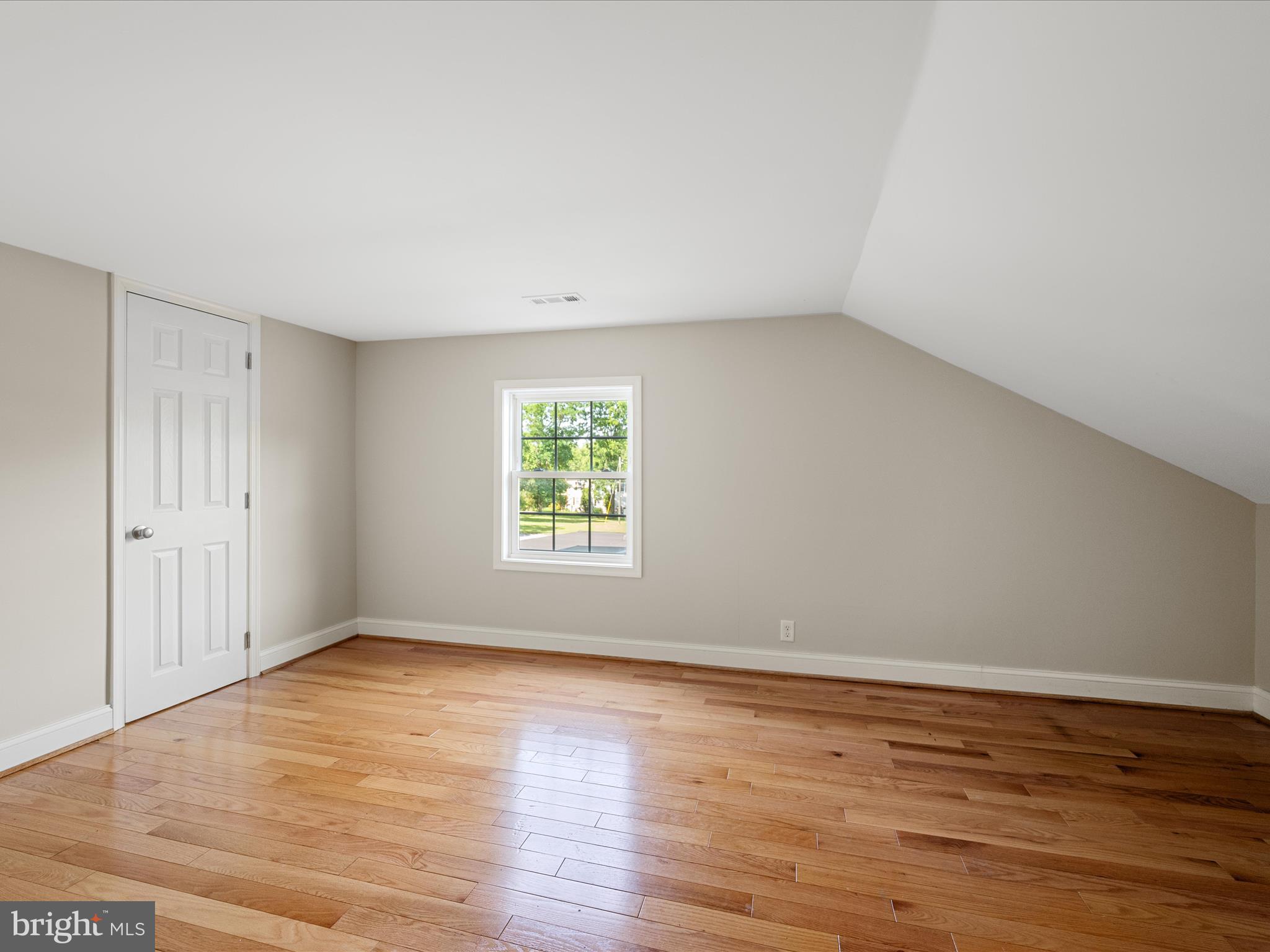 87 Old Waterloo Road Boyce, VA 22620 - Photo 46 of 76 a view of an empty room with wooden floor and a window