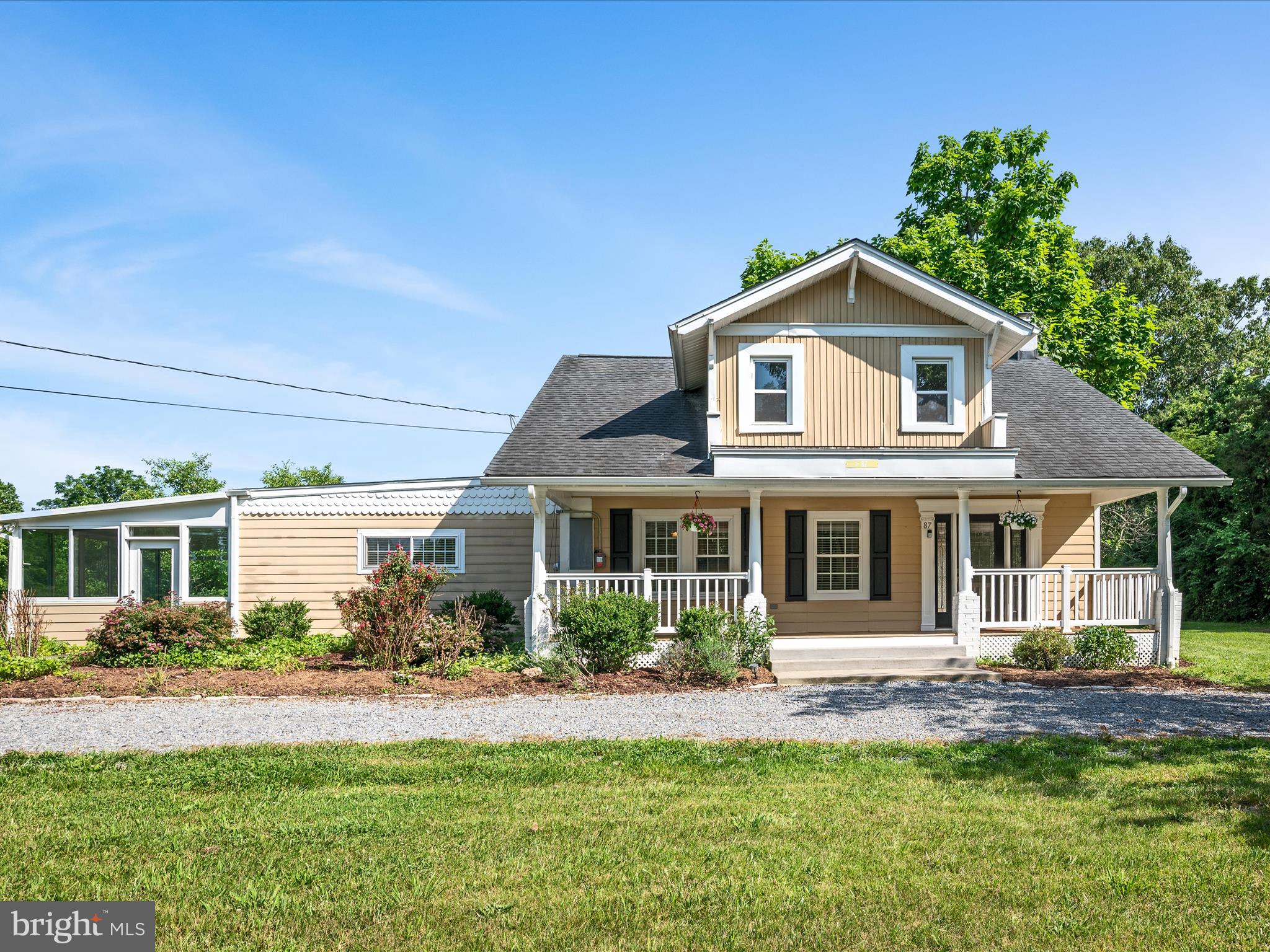 87 Old Waterloo Road Boyce, VA 22620 - Photo 5 of 76 a front view of a house with a yard and potted plants