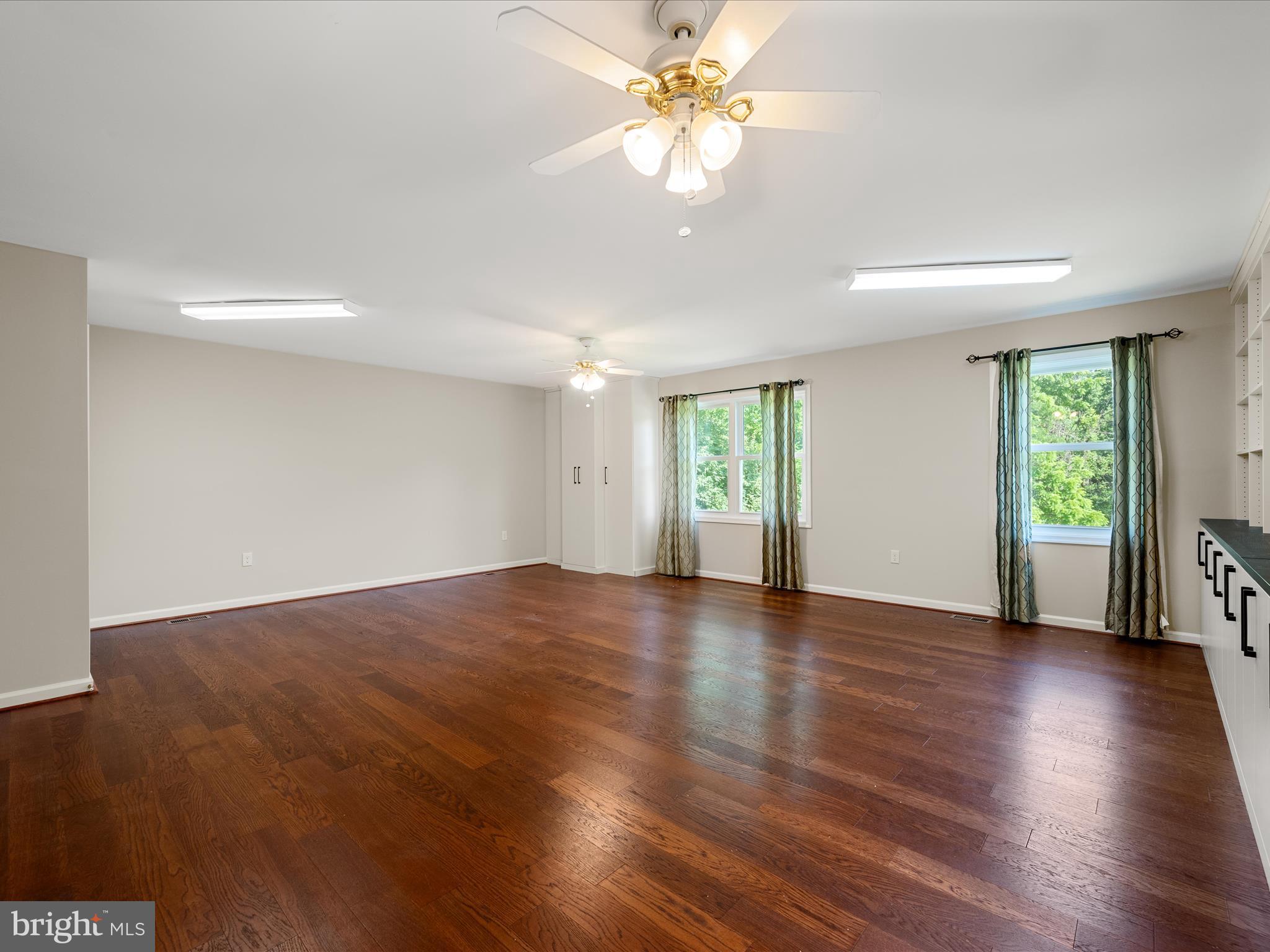 87 Old Waterloo Road Boyce, VA 22620 - Photo 51 of 76 a view of an empty room with window and wooden floor