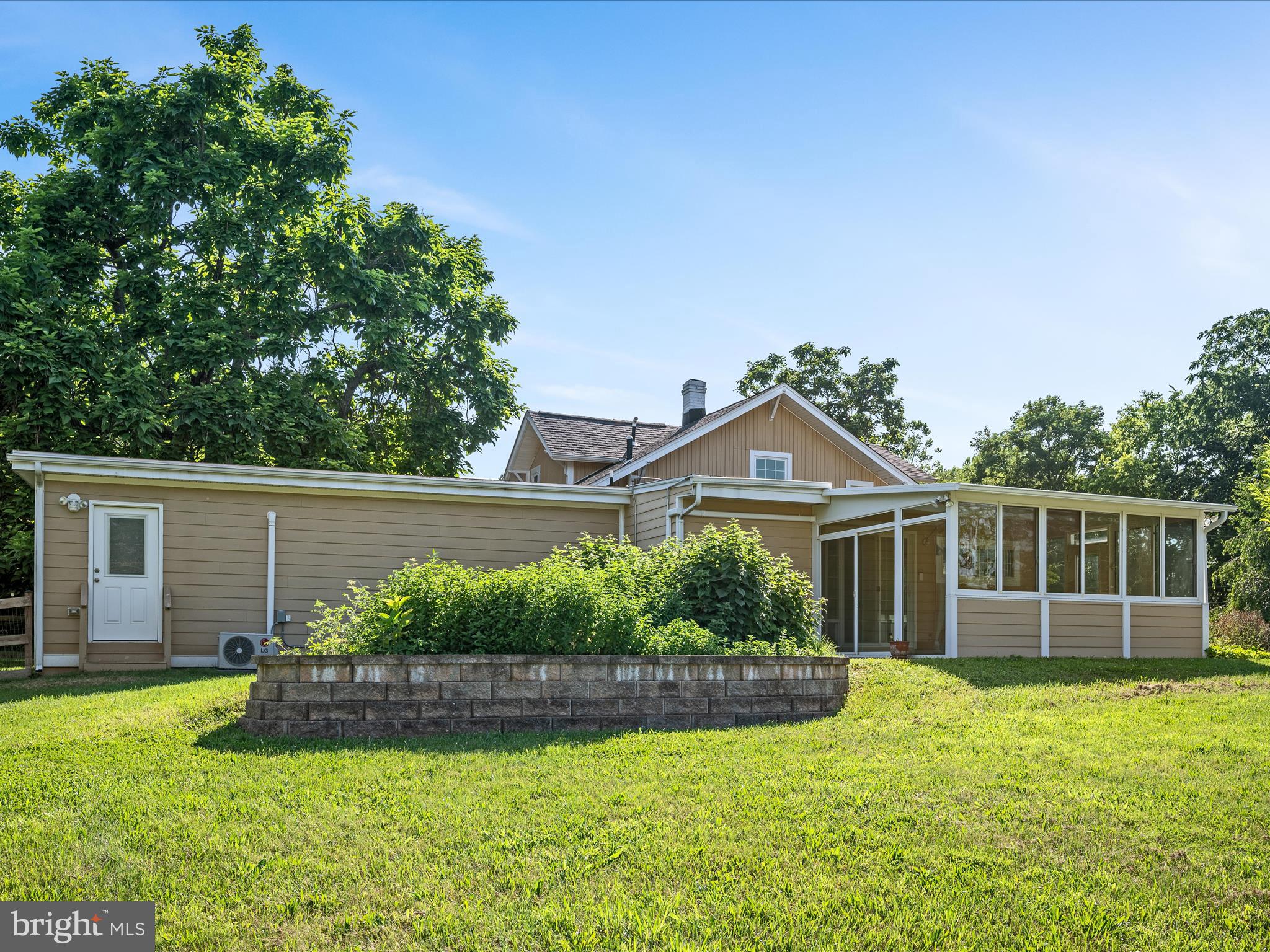 87 Old Waterloo Road Boyce, VA 22620 - Photo 56 of 76 a front view of a house with a yard and potted plants