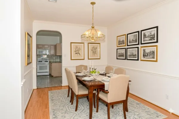 a dining room with furniture and window
