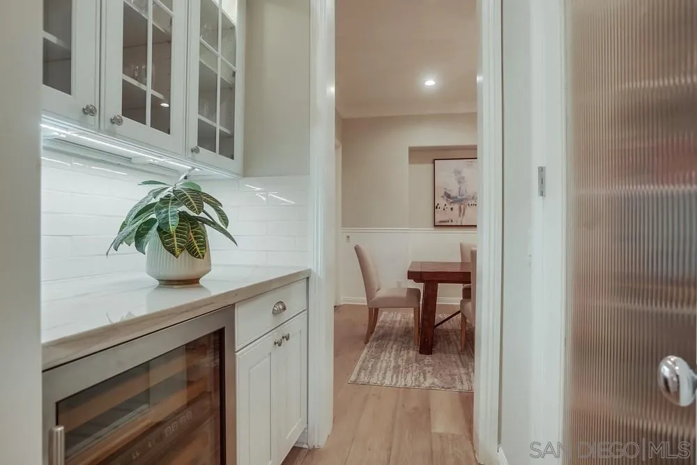 1463 Paseo De Las Flores Encinitas, CA 92024 - Photo 15 of 28 a view of a hallway and dining room and wooden floor