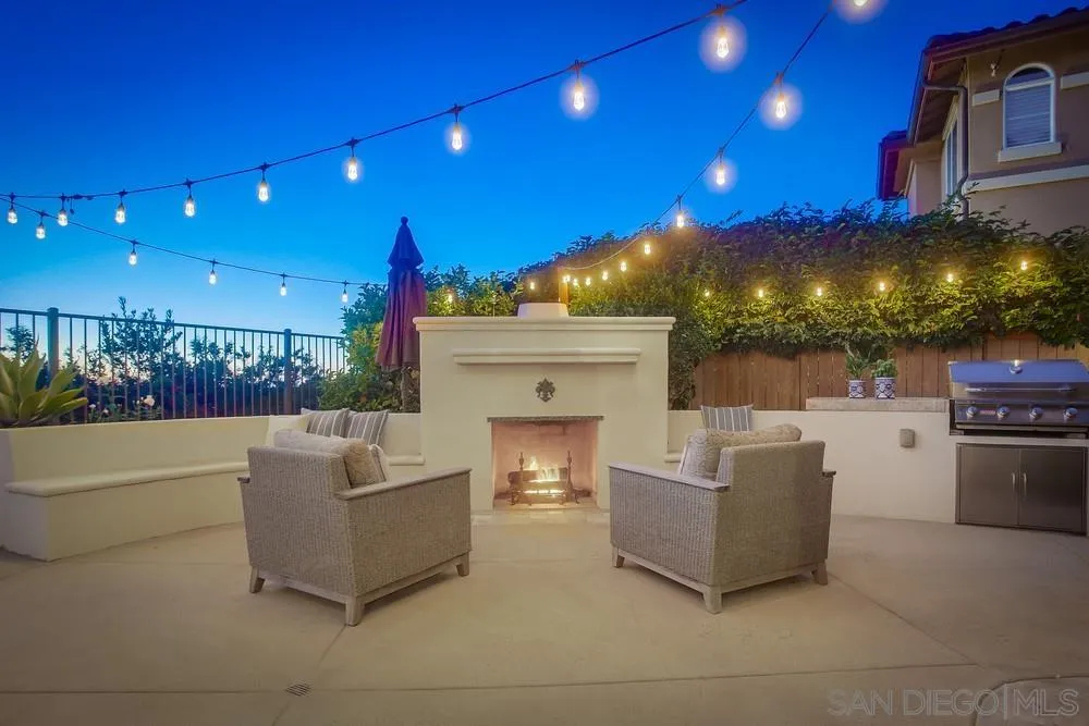 1463 Paseo De Las Flores Encinitas, CA 92024 - Photo 20 of 28 a view of a patio with couches and potted plants with wooden floor