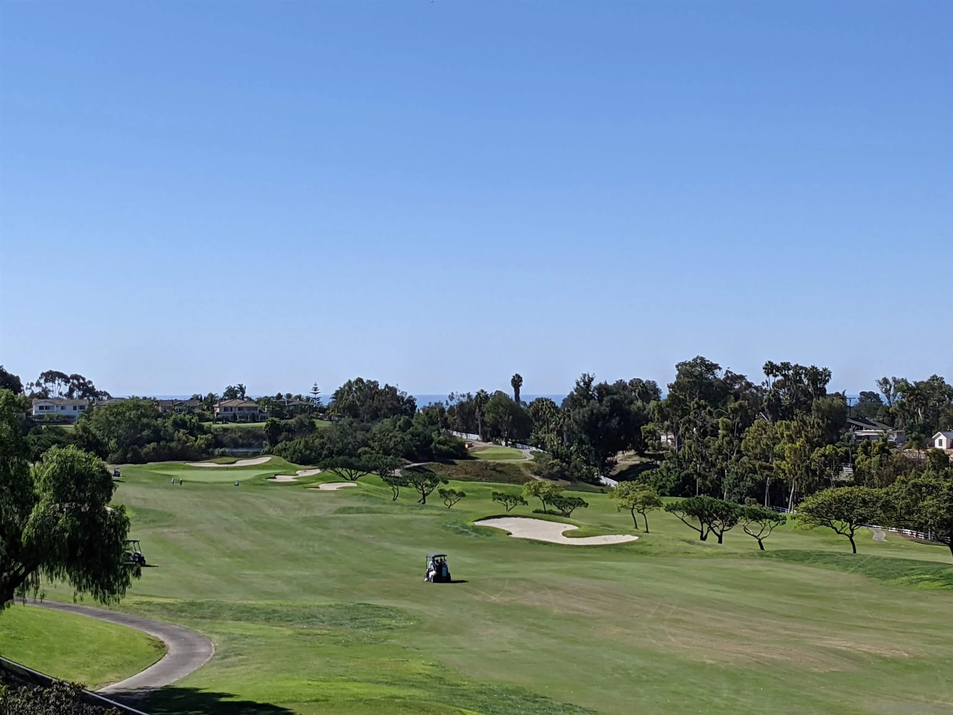 1463 Paseo De Las Flores Encinitas, CA 92024 - Photo 2 of 28 a view of a golf course with a lake