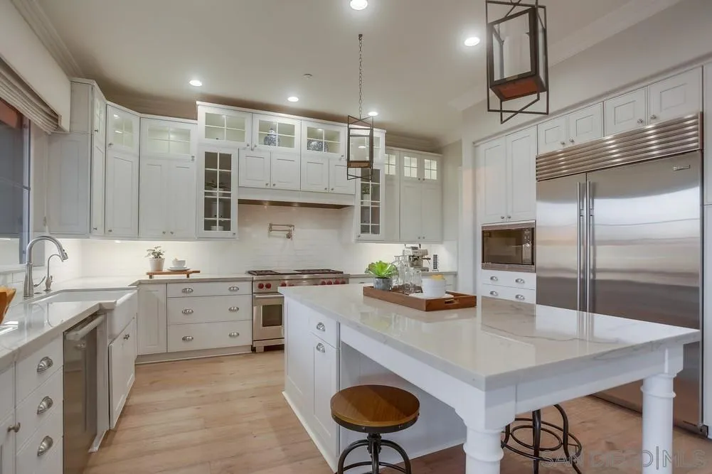 1463 Paseo De Las Flores Encinitas, CA 92024 - Photo 10 of 28 a kitchen with stainless steel appliances granite countertop a sink a stove and a refrigerator