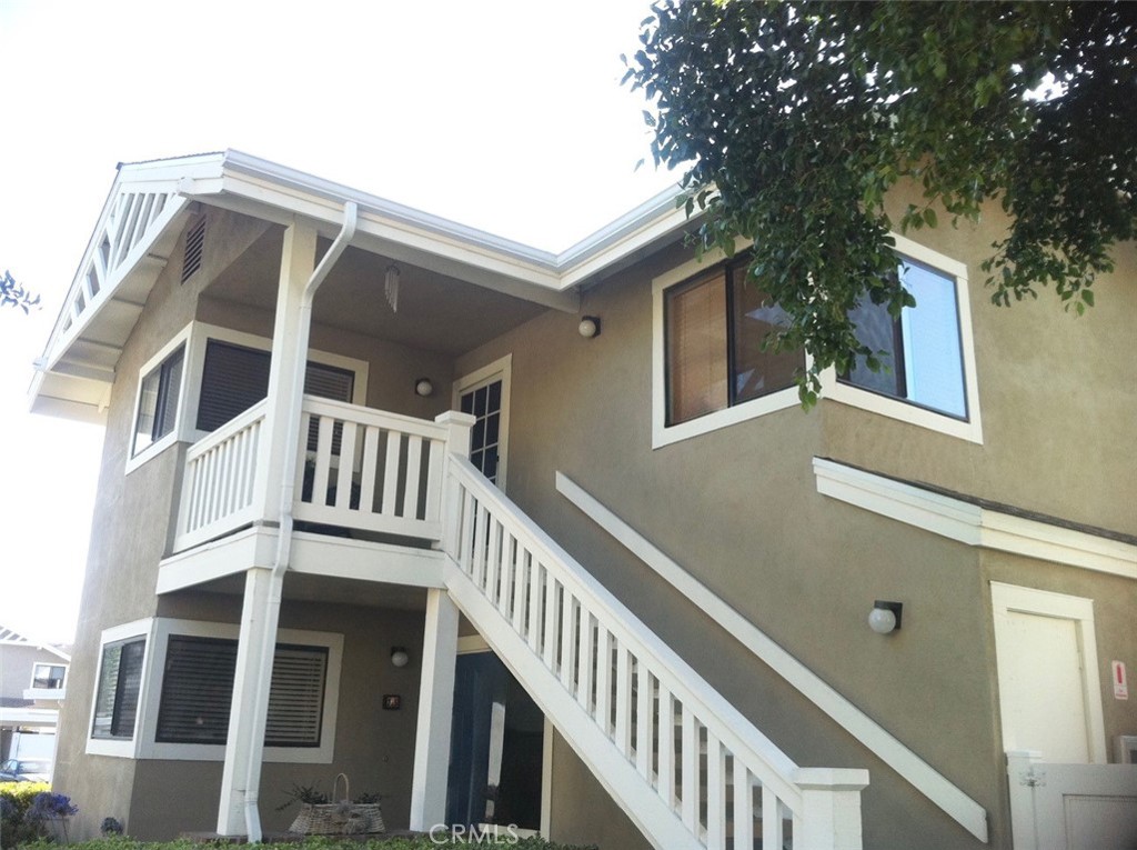 a view of a house with a small yard