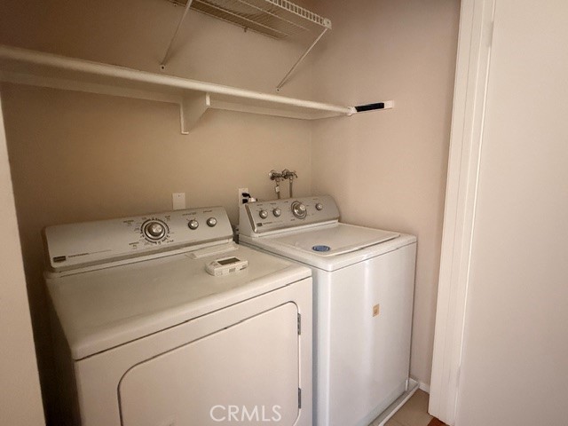 217 Tarocco Irvine, CA 92618 - Photo 12 of 13 a utility room with dryer and washer