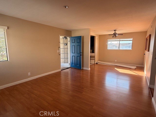 217 Tarocco Irvine, CA 92618 - Photo 13 of 13 an empty room with wooden floor and windows