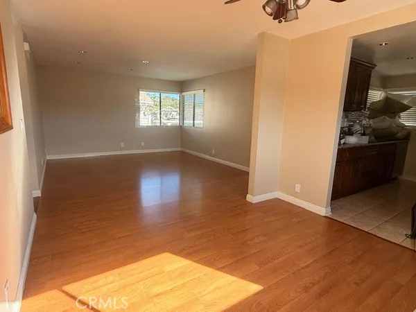 a view of a dining room with furniture and a chandelier