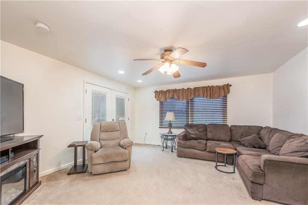 340 Spring Valley Road Pittsburgh, PA 15243 - Photo 15 of 44 a living room with furniture and a flat screen tv