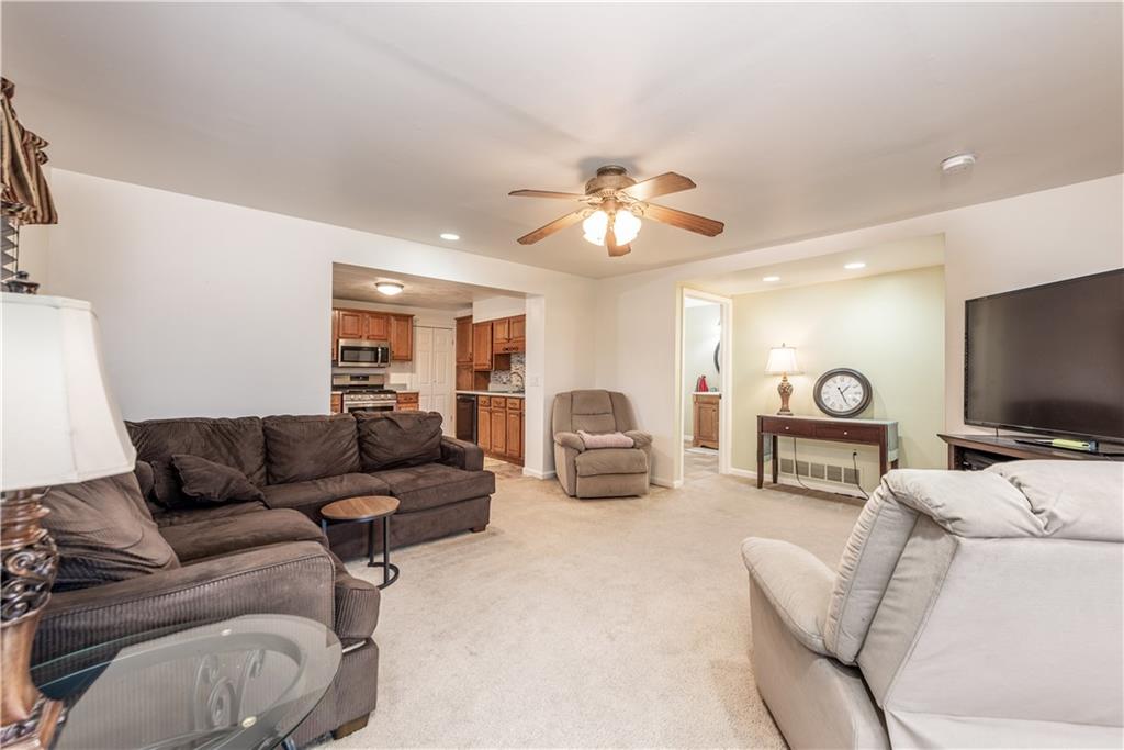 340 Spring Valley Road Pittsburgh, PA 15243 - Photo 17 of 44 a living room with furniture and a flat screen tv
