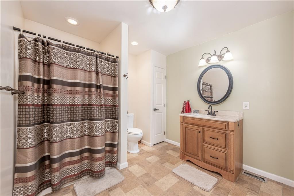 340 Spring Valley Road Pittsburgh, PA 15243 - Photo 18 of 44 a bathroom with a sink a toilet and a shower