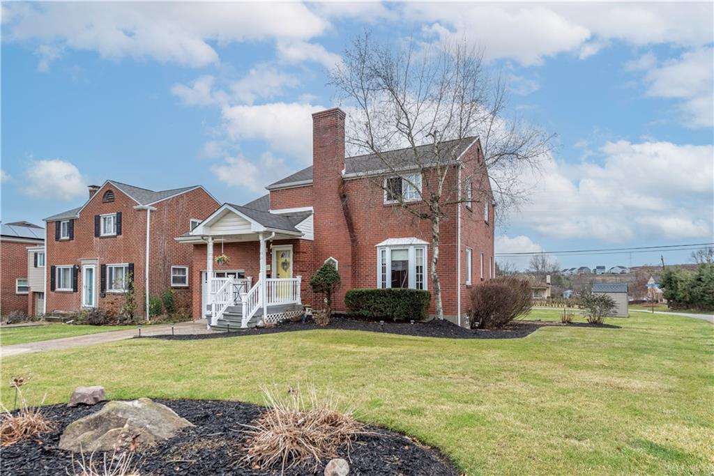340 Spring Valley Road Pittsburgh, PA 15243 - Photo 2 of 44 a front view of house with yard and trees in the background