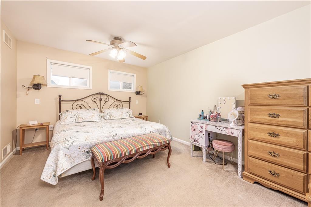 340 Spring Valley Road Pittsburgh, PA 15243 - Photo 21 of 44 a bedroom with a bed and a ceiling fan
