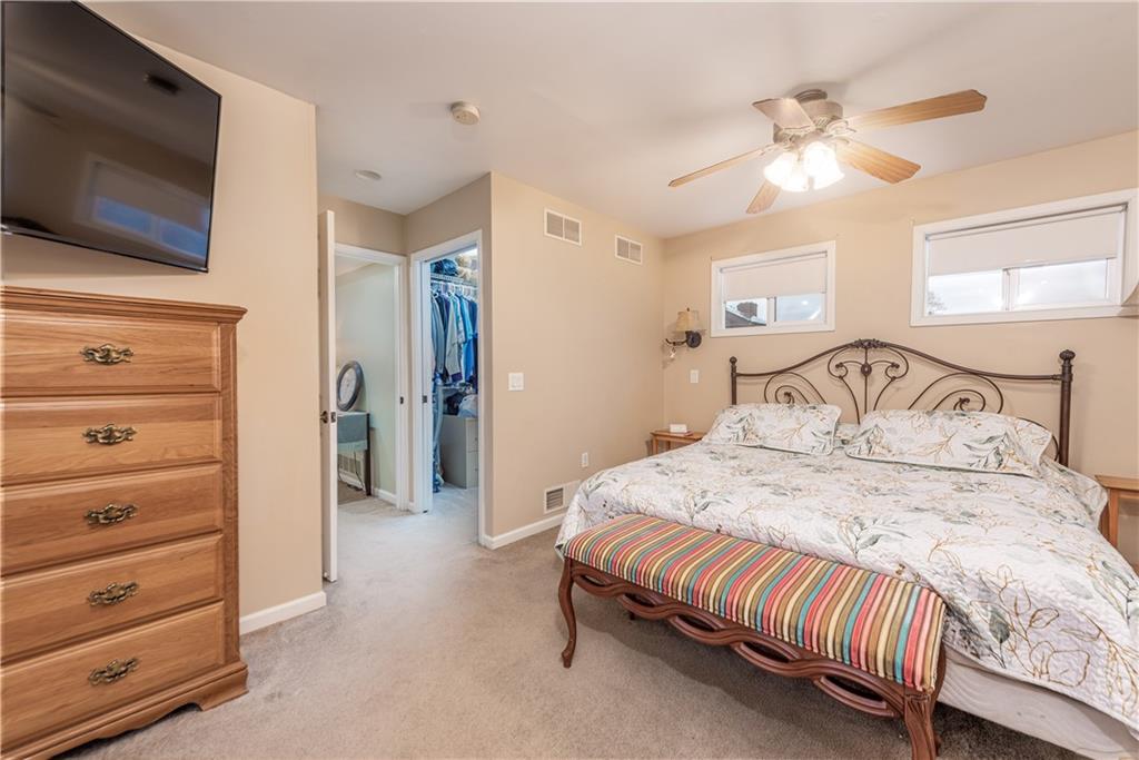 340 Spring Valley Road Pittsburgh, PA 15243 - Photo 22 of 44 a bedroom with a bed a flat screen tv and a dresser