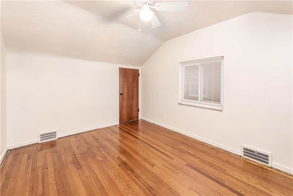 340 Spring Valley Road Pittsburgh, PA 15243 - Photo 25 of 44 a view of an empty room with wooden floor and a window
