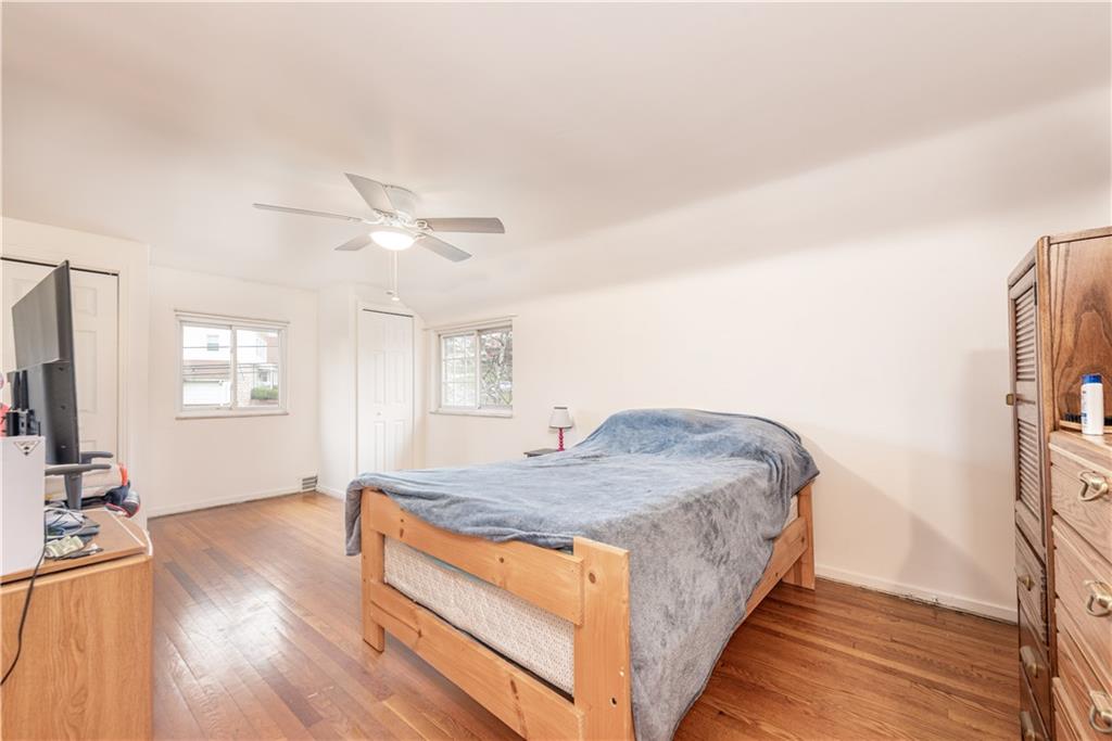 340 Spring Valley Road Pittsburgh, PA 15243 - Photo 28 of 44 a spacious bedroom with a bed and a flat screen tv