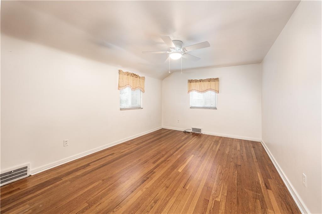 340 Spring Valley Road Pittsburgh, PA 15243 - Photo 30 of 44 wooden floor in an empty room with a window