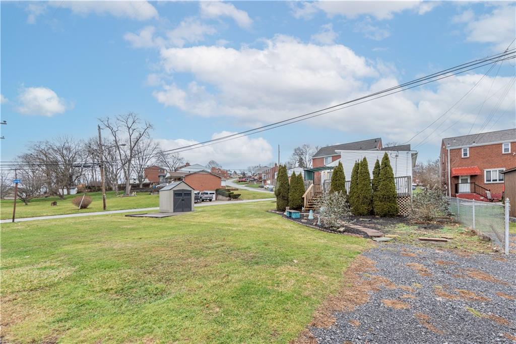 340 Spring Valley Road Pittsburgh, PA 15243 - Photo 42 of 44 a view of a big yard with table and chairs in front of the house