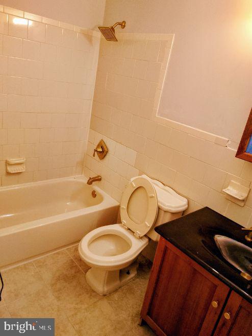 9110 Meadow Heights Road Randallstown, MD 21133 - Photo 15 of 21 a bathroom with a toilet and a shower