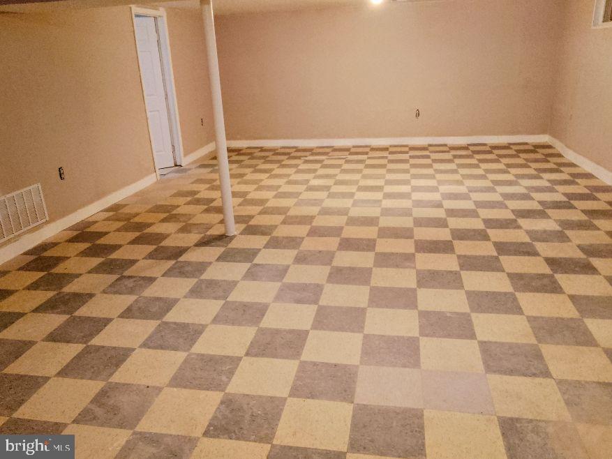 9110 Meadow Heights Road Randallstown, MD 21133 - Photo 19 of 21 a view of a black and white checkered floor