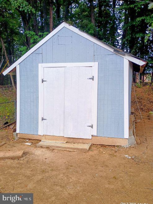 9110 Meadow Heights Road Randallstown, MD 21133 - Photo 21 of 21 a view of a small house with yard