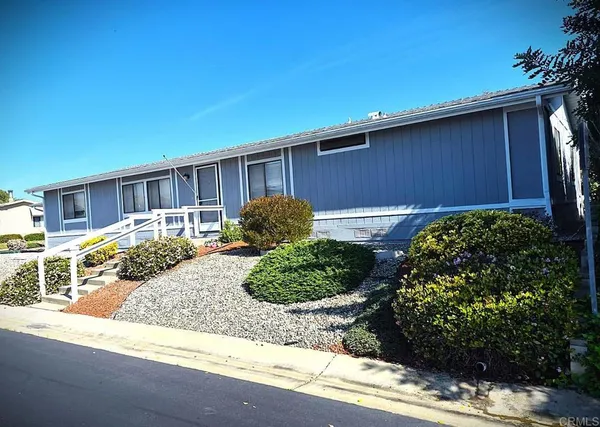 a view of a backyard of the house