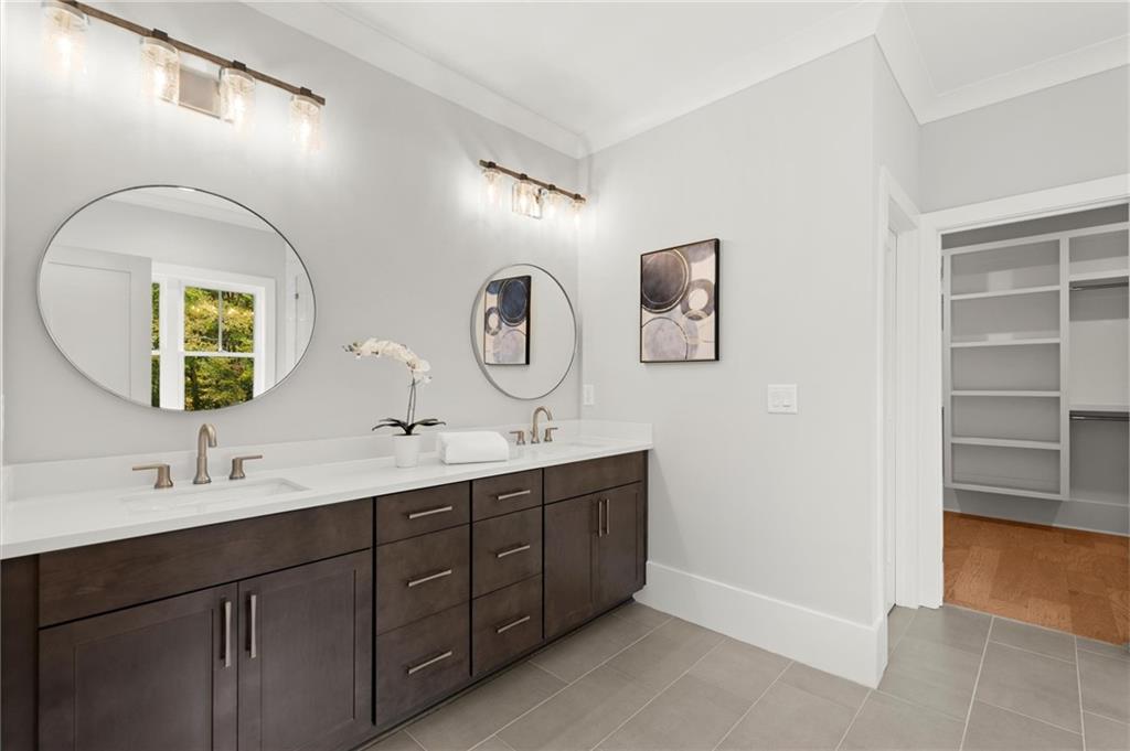 3794 Wynn Walk Brookhaven, GA 30341 - Photo 22 of 50 a bathroom with a double vanity sink and a mirror