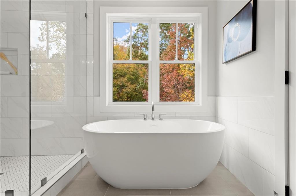 3794 Wynn Walk Brookhaven, GA 30341 - Photo 24 of 50 a white bath tub sitting next to a window